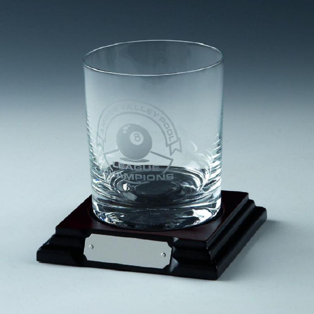 Single spirit glass on wood base Single spirit glass on wood base